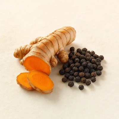 Turmeric root with black peppercorns